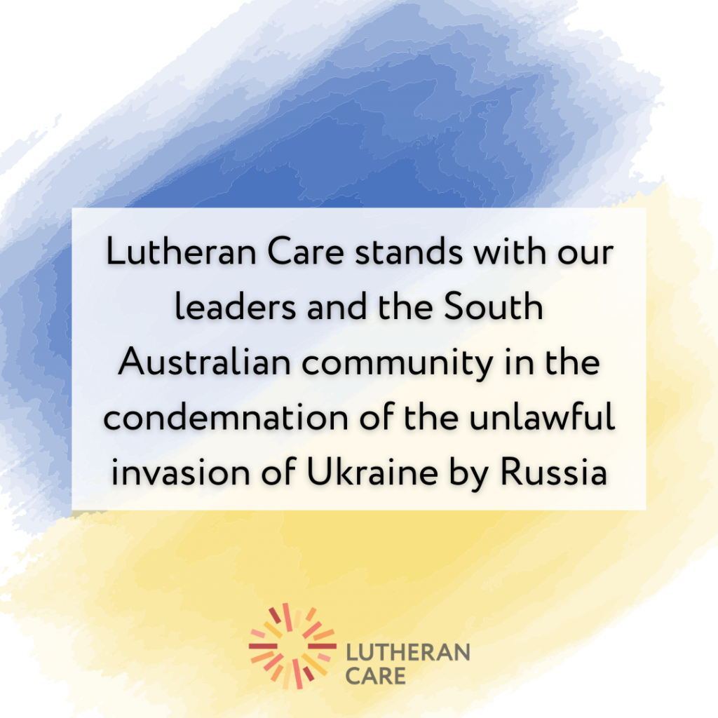 A graphic featuring the Ukraine flag colours and Lutheran Care logo. The text reads: "Lutheran Care stands with our leaders and the SA community in the condemnation of the unlawful invasion of Ukraine by Russia
