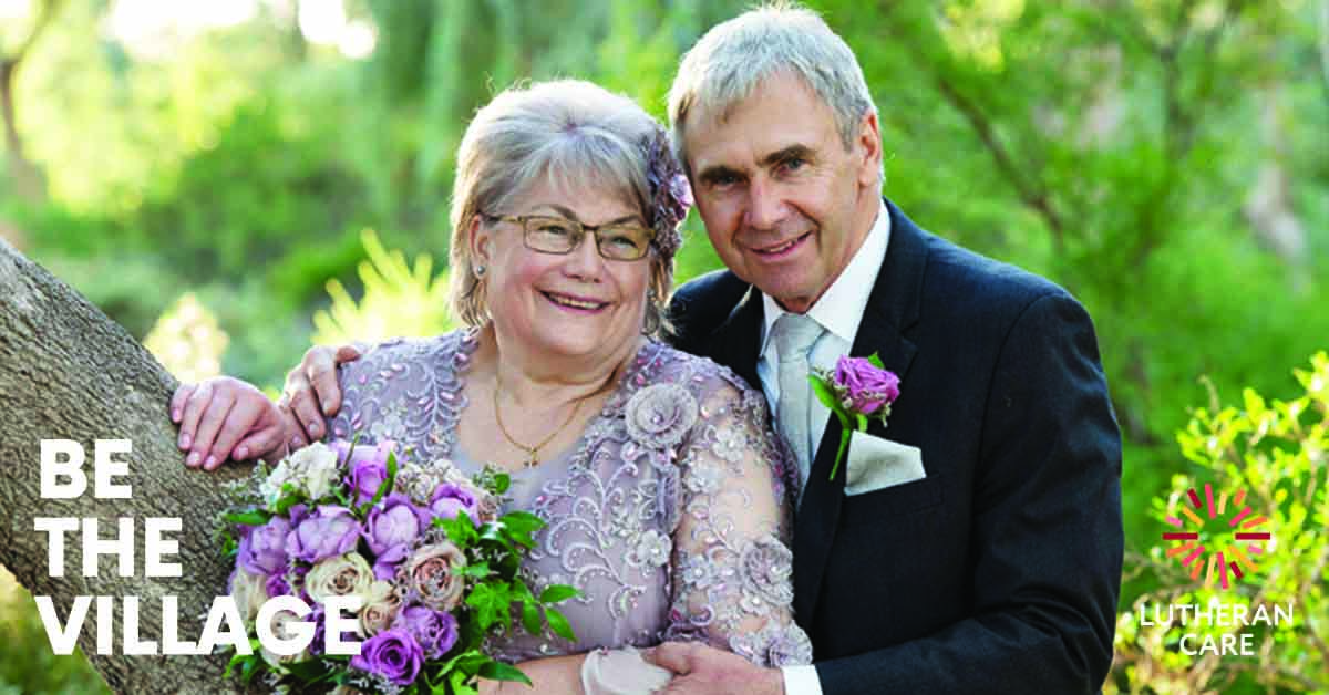 Image of foster carers Leonie and Rod. Be The Village and Lutheran Care appears at the bottom of the image.