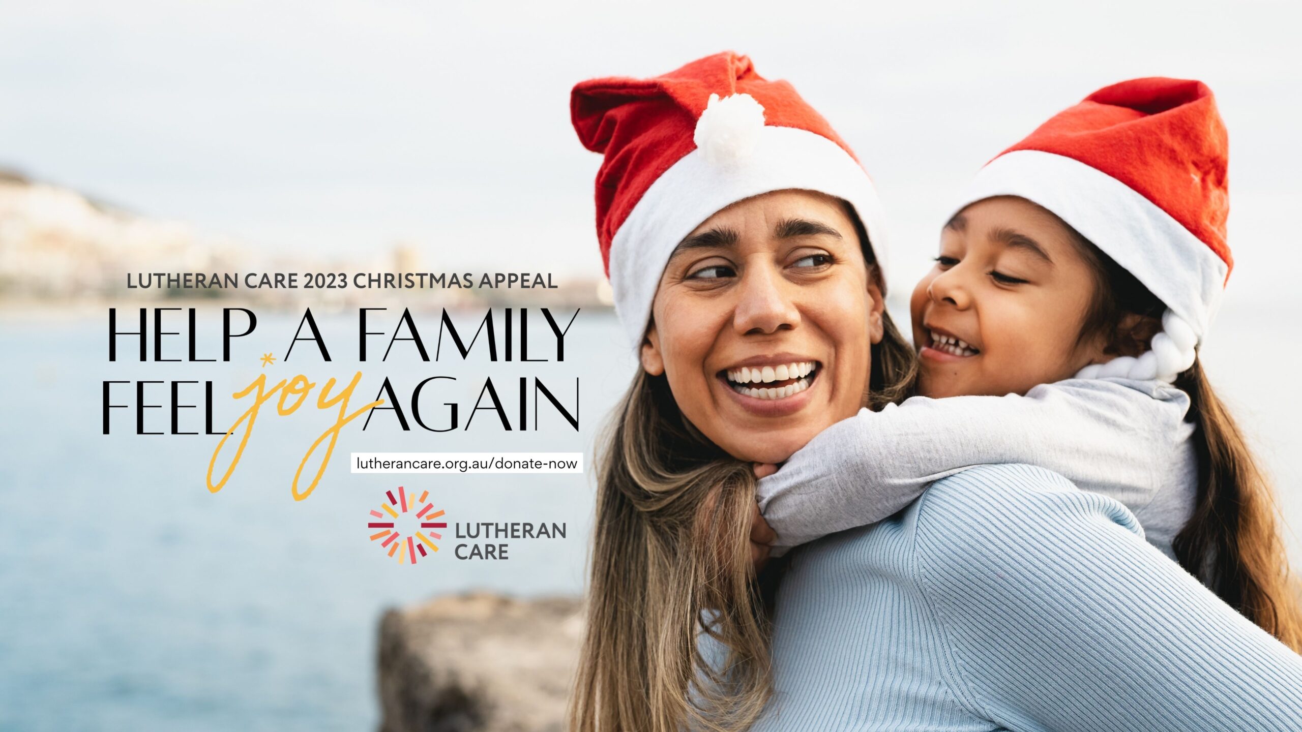A mother is carrying her young daughter on her back, both are smiling and wearing Santa hats. Text reads Help a Family Feel Joy again with the Lutheran Care logo below.