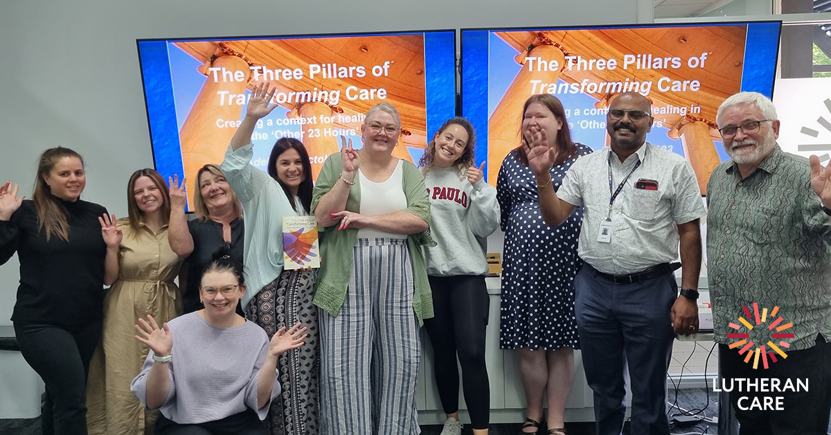 Foster carers and LC staff at Three Pillars training. The Lutheran Care logo appears in the bottom right hand corner.