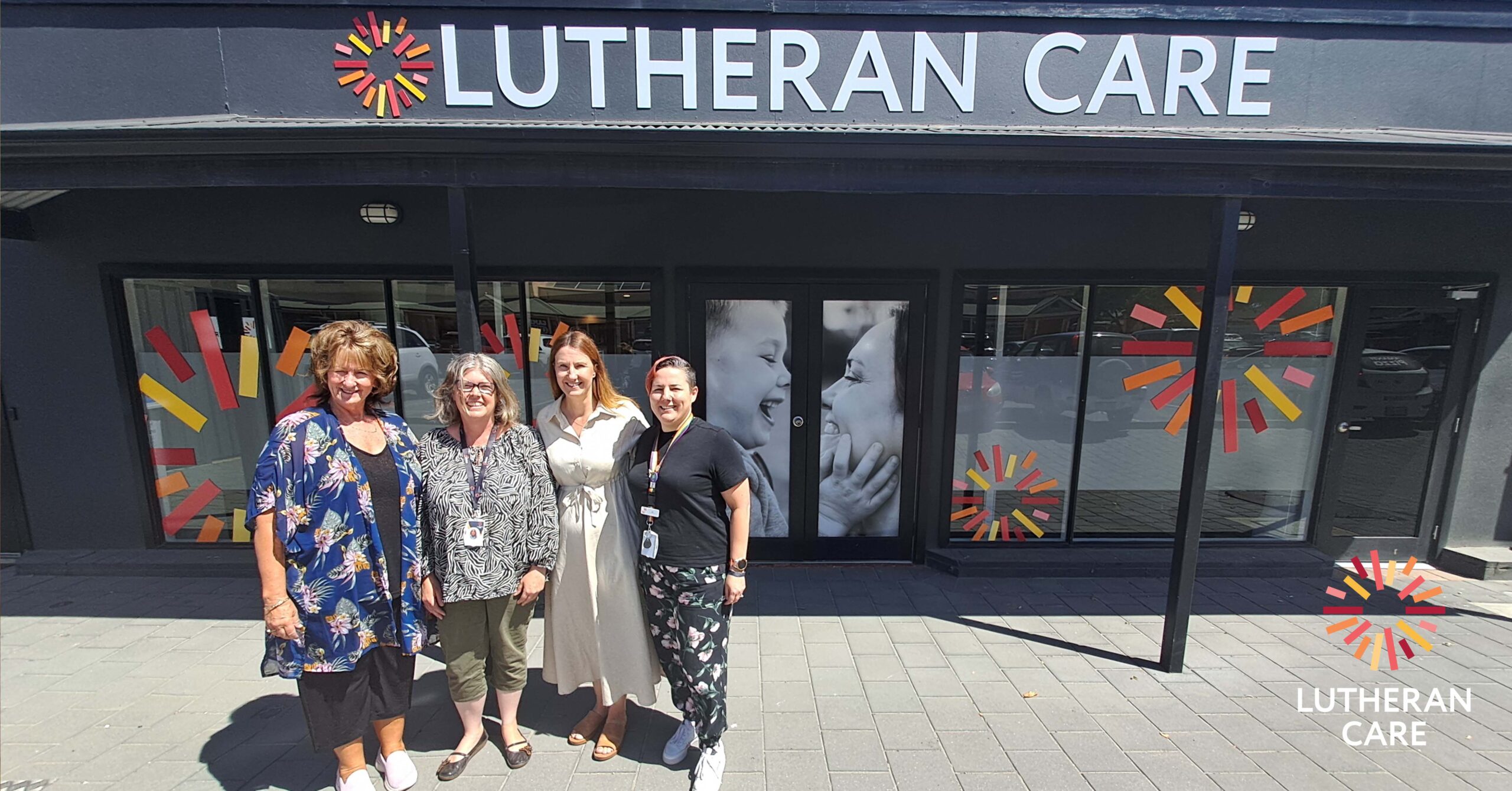Lutheran Care Barossa staff outside of the new Tanunda office. The Lutheran Care logo appears in the bottom right hand corner.