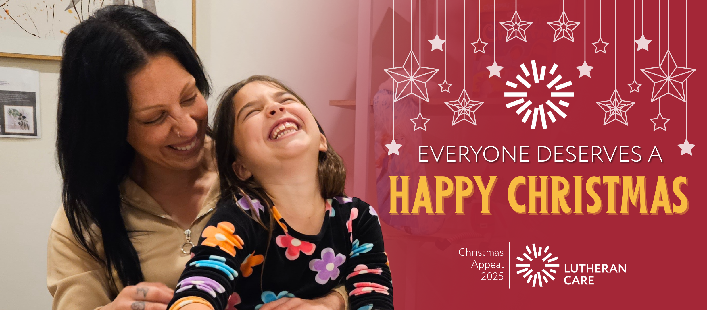 Lutheran Care Christmas Appeal banner showing a laughing Mother and Daughter. Text reads everyone deserves a Happy Christmas.