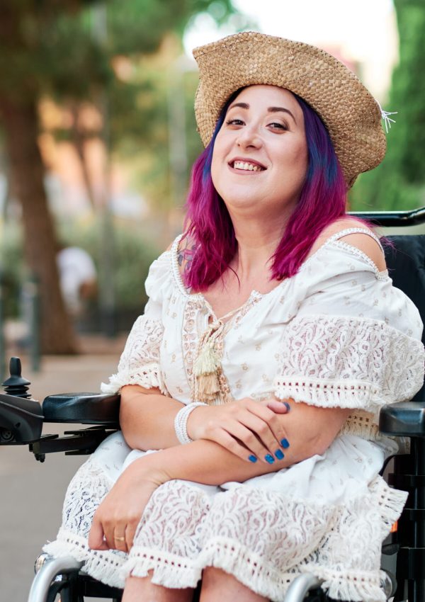 Young adult woman with disabiliites looking at camera